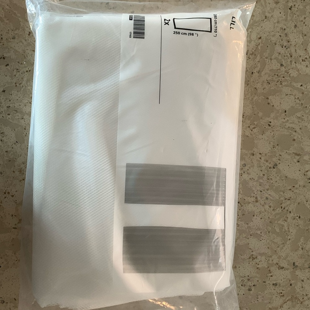 IKEA LILL curtain sheer. 2 per bag, dimensions 110” x 98”